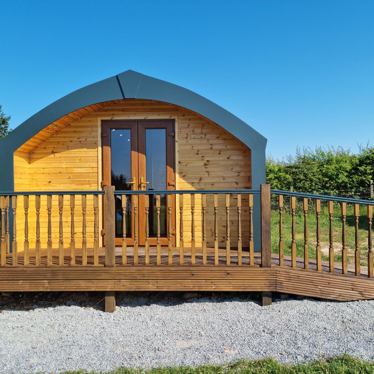 A Greencraig pod with its raised deck and railing
